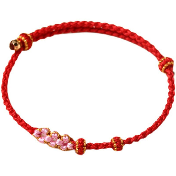 Rotes Armband Pfirsichblüte – Schutz mit rosa Perlen elastisch