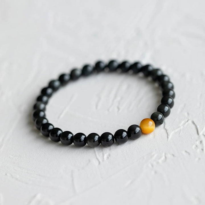 Schwarzes Obsidian Armband mit gelbem Tigerauge Stein eleganter Schmuck