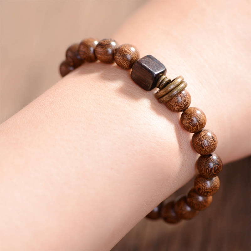 Armband Phoebe Zhennan Holz braune Perlen Spiritualität elastisch