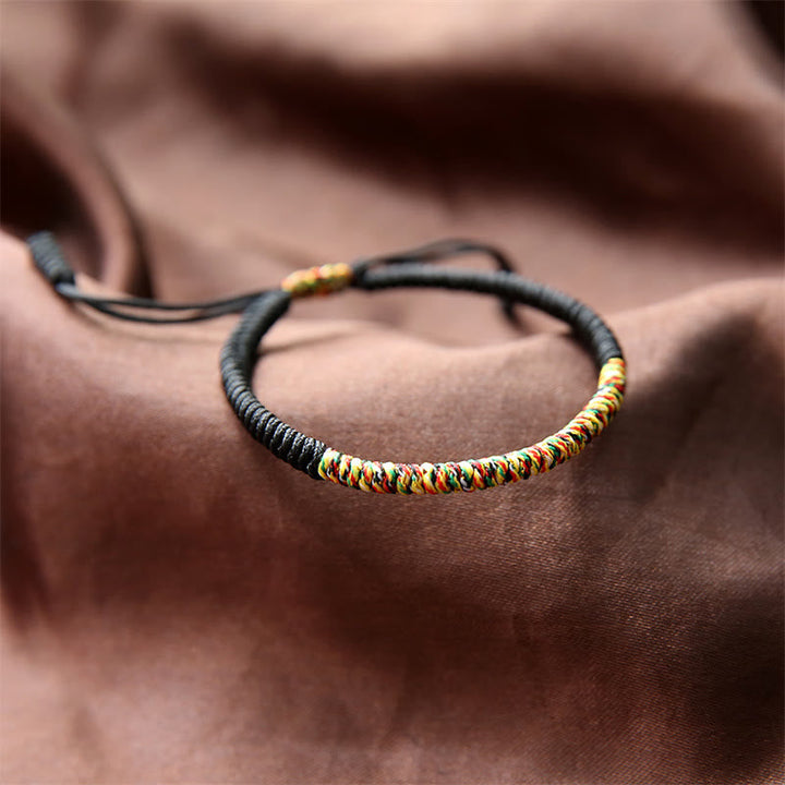 Armband – Glück & Stärke schwarzes Seil bunte Perlen elastisch handmade