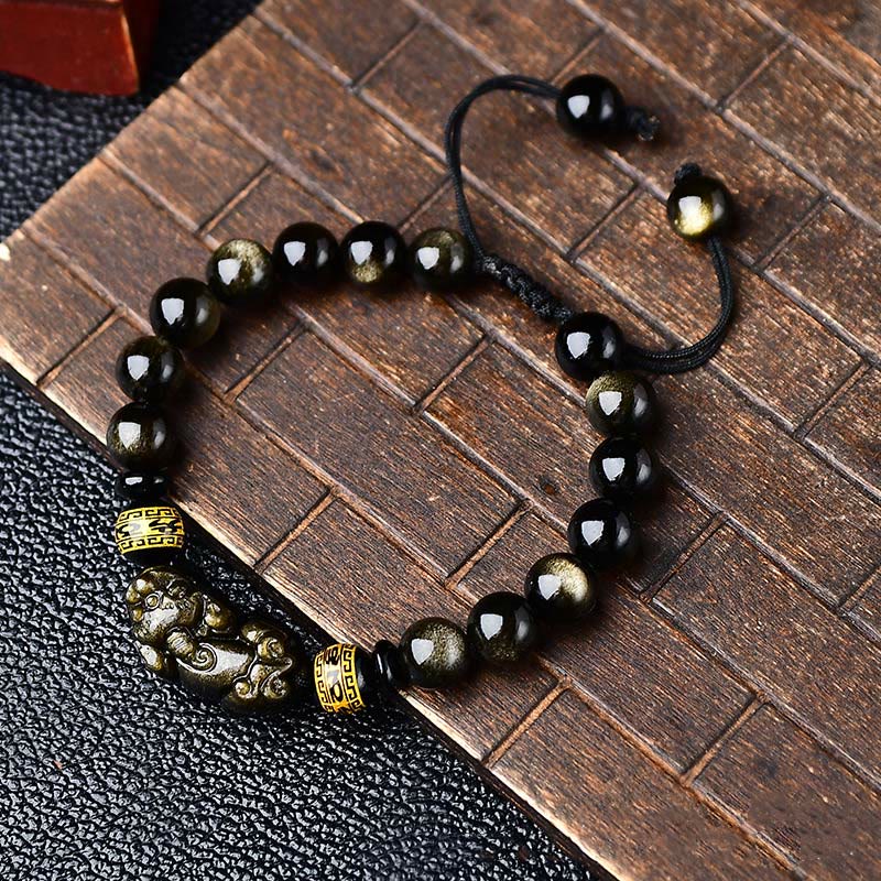 Schwarzes Obsidian Armband mit Om Mani Padme Hum Anhänger elegant.