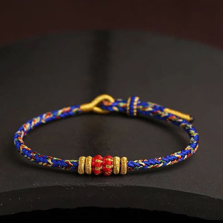 Armband bunt geflochten Knoten Glück blau rot gold elegant