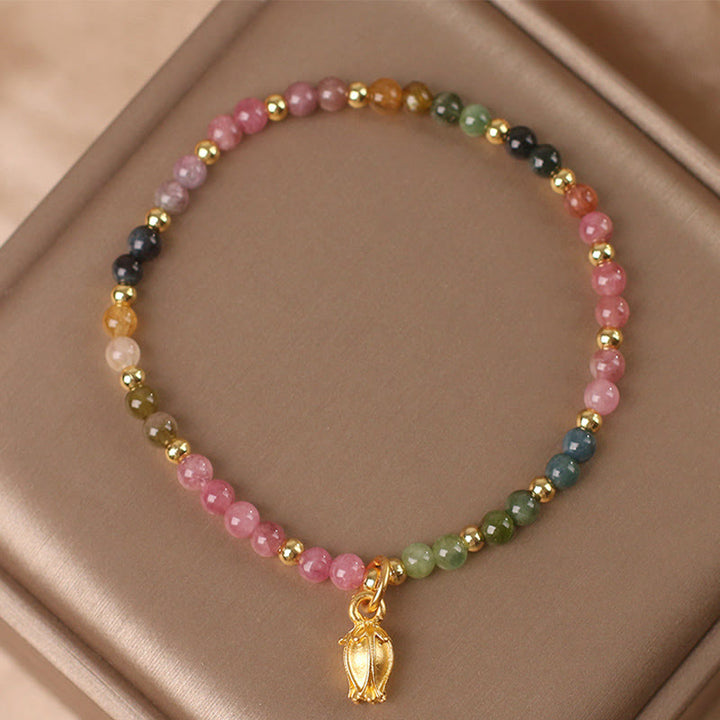 Armband Turmalin Blüten – Energie mit goldenem Blütenanhänger Perlen