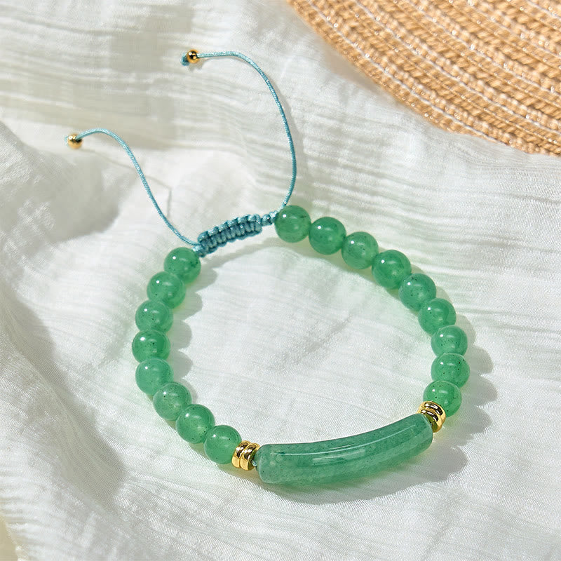 Armband Erdbeerquarz Grüner Aventurin – Positivität mit goldenen Perlen auf Stoff