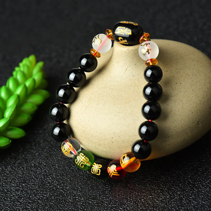 Armband Schwarzer Onyx – Glück Energie mit goldenen Perlen elegant.