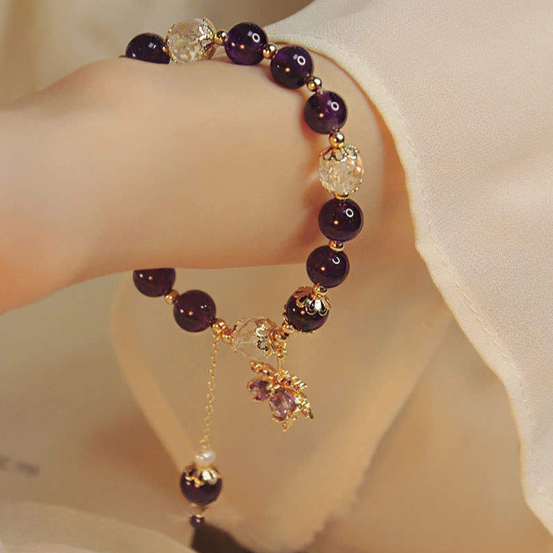 Armband Amethyst Heilung Energie dunkle Perlen Gold Charm elegant