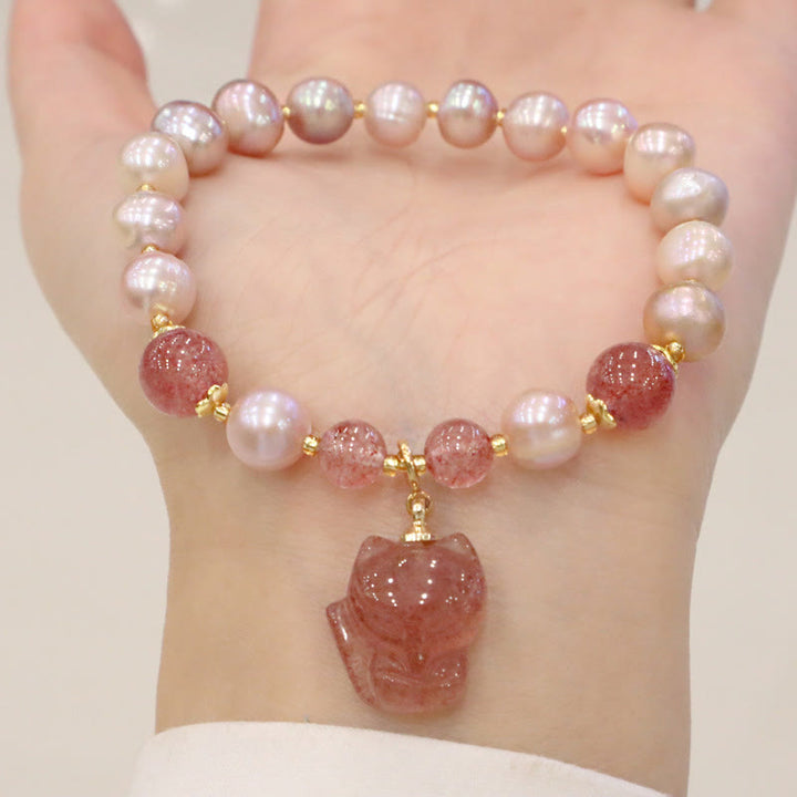 Armband Erdbeerquarz Perle Fuchs rosa Perlen elastisch Handgelenk getragen