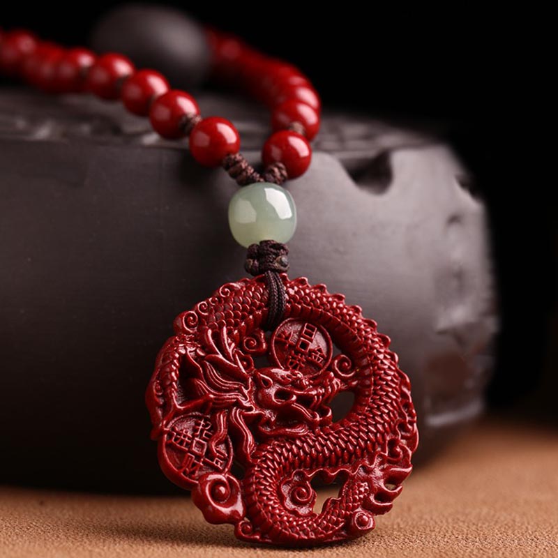 Zinnober Drachen Armband Anhänger Nahaufnahme rotes Kupfer Naturstein Wohlstand