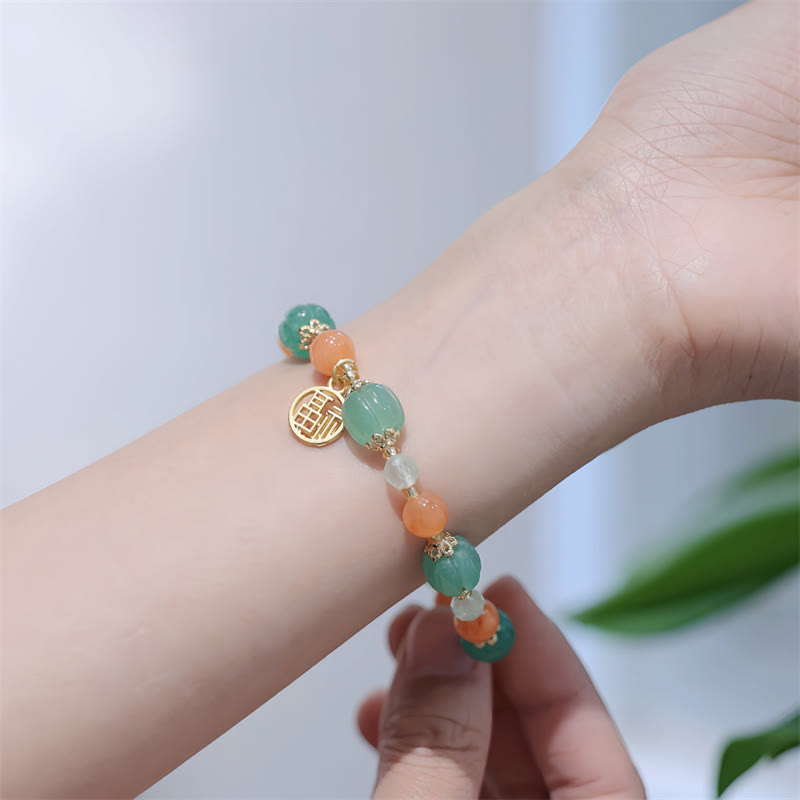 Jade Armband Fu-Zeichen Wohlstand grün orange Perlen elegant Handgelenk