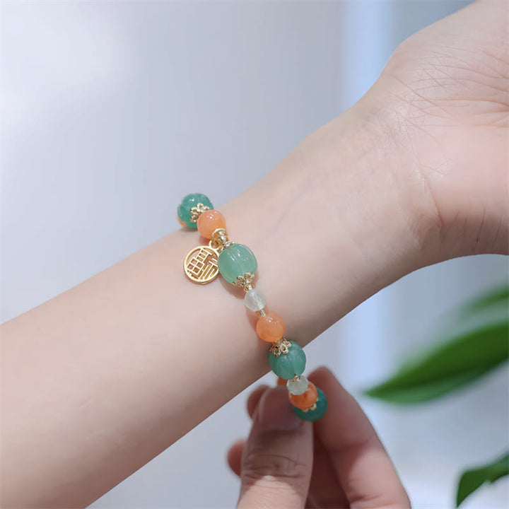 Jade Armband Fu-Zeichen Wohlstand grün orange Perlen elegant Handgelenk
