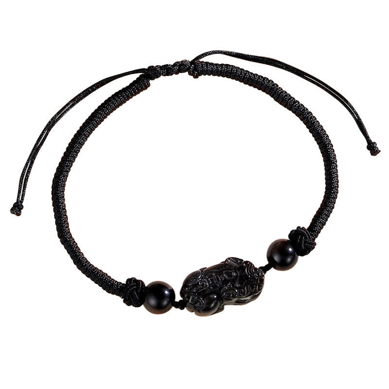 Schwarzes Pixiu Armband mit Obsidian Perlen auf elastischem Textilband.