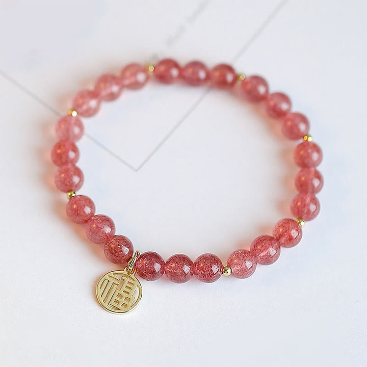 Armband Erdbeerquarz Fu-Zeichen – Heilung rosafarbene Perlen Goldakzente