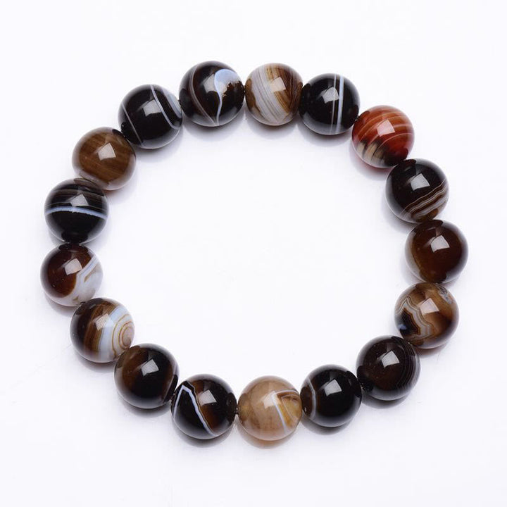 Armband Onyx – Glück Energie mit gestreiften braunschwarzem Naturstein.