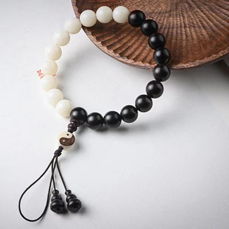 Armband Ebenholz – Schutz weiß schwarz Perlen Yin Yang Design