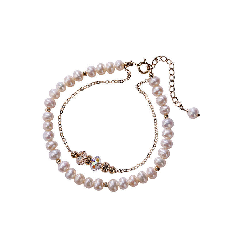 Perlenarmband mit Kristallperlen und goldfarbenen Metallakzenten elegant.
