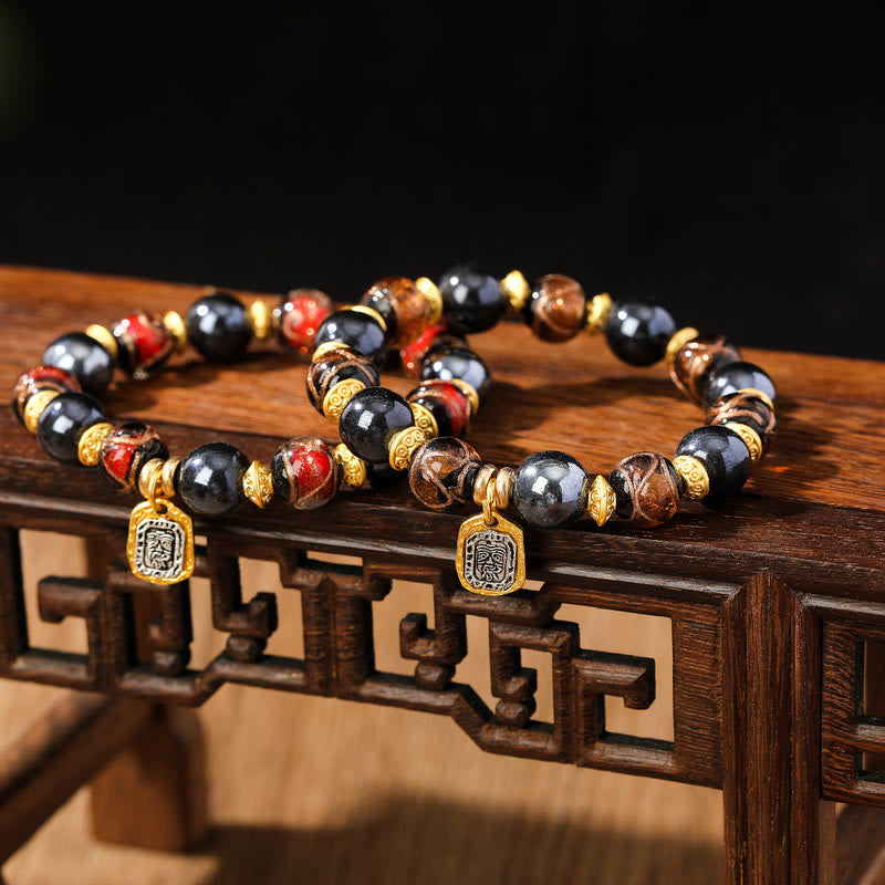 Armband Zakiram Glück Wohlstand schwarze Obsidian Perlen goldene Spacer elegant