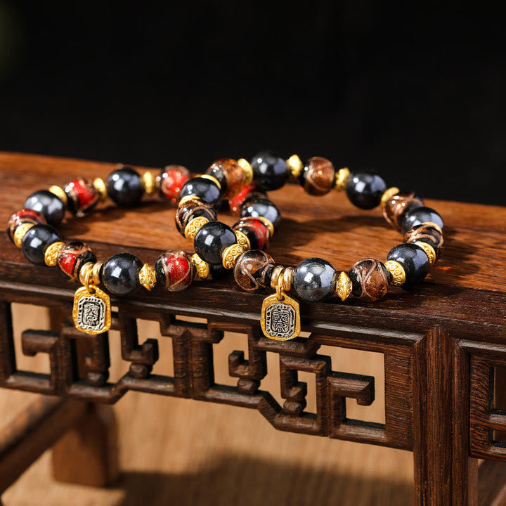 Armband Zakiram Glück Wohlstand schwarze Obsidian Perlen goldene Spacer elegant