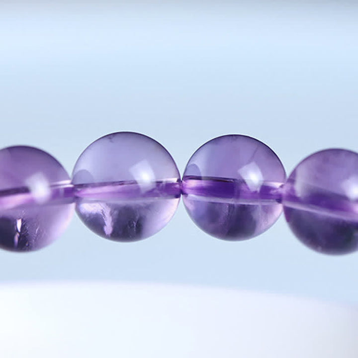 Armband Amethyst Kristall lila Perlen Schnur elastisch Naturstein