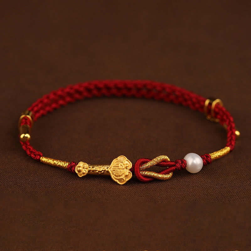 Rotes Armband Perle Fu-Zeichen Glück goldene Akzente traditionell elegant