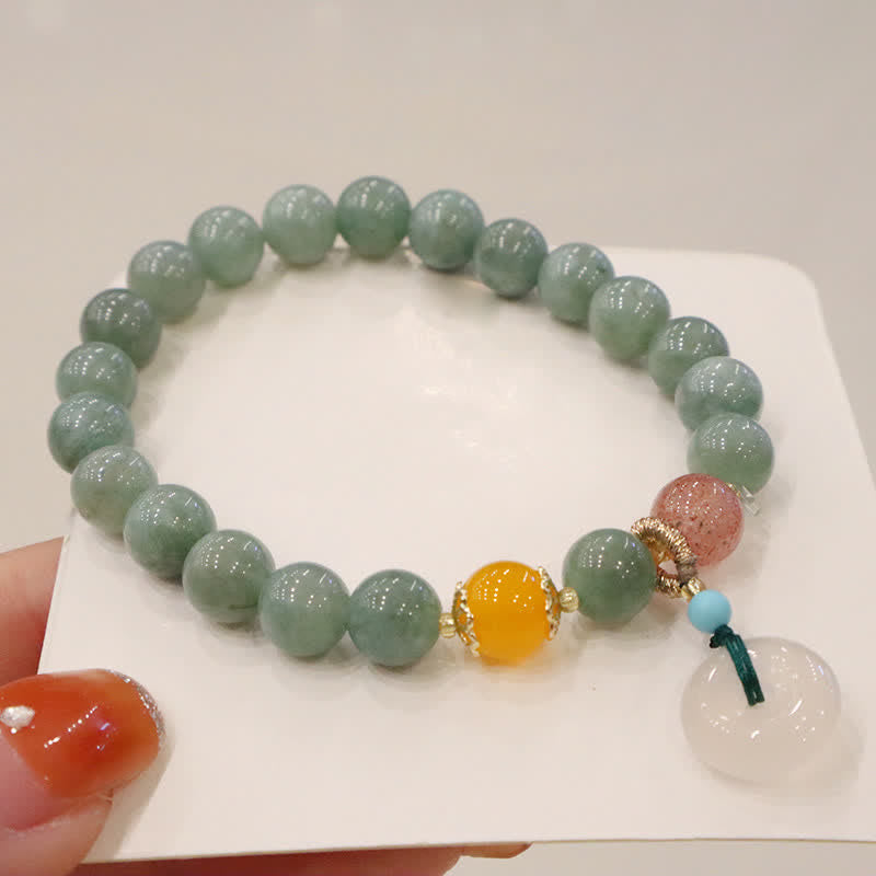 Jade Armband mit gelben und rosa Steinen elegant präsentiert