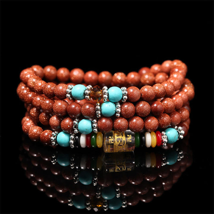 Rotes Armband Om Mani Padme Hum mit türkisen Perlen Balance