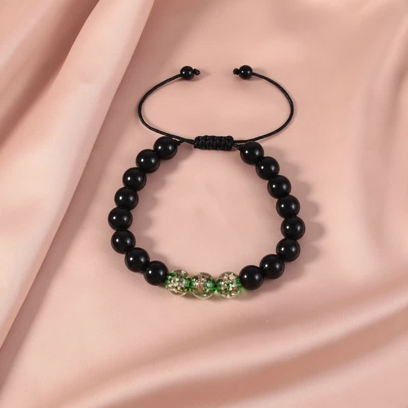 Armband Schwarzer Obsidian – Stärke mit grünen Kristallperlen elegant.