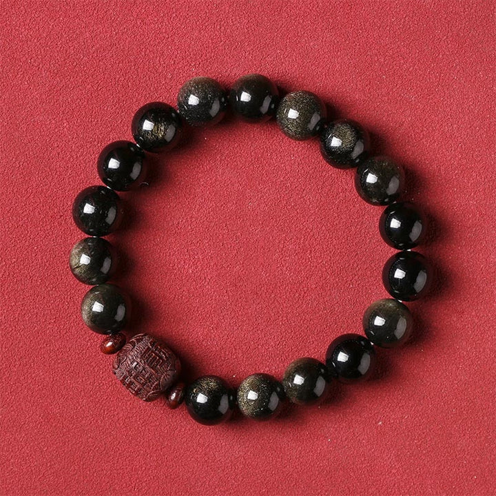 Schwarzes Obsidian Armband mit Om Mani Padme Hum Anhänger rot.