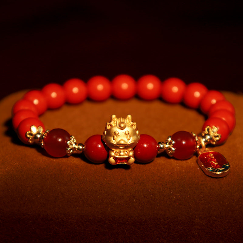 Armband Zinnober Drachen – Schutz rote Perlen goldener Drache elegantes Design