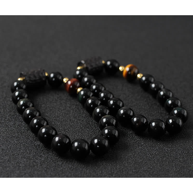 Zwei elastische Armbänder schwarzer Obsidian mit Tigerauge Akzenten