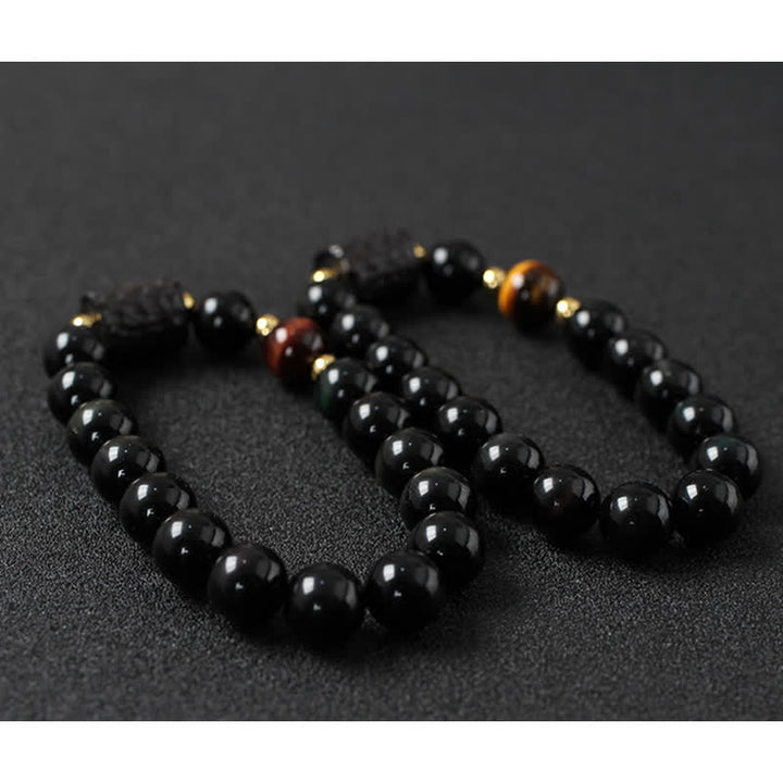 Zwei elastische Armbänder schwarzer Obsidian mit Tigerauge Akzenten