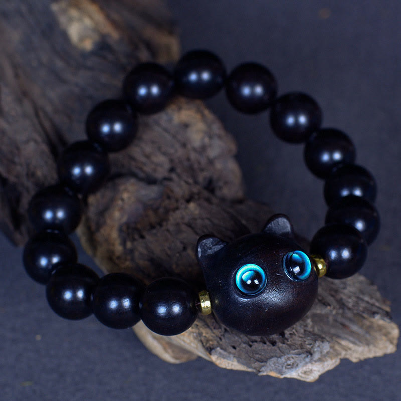 Schwarzes Ebenholz Katzen-Armband mit blauen Augen Naturstein.