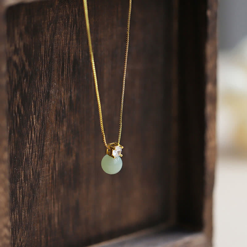 Anhänger Jade Perle Wohlstand Glück goldene Kette Naturstein Schmuck