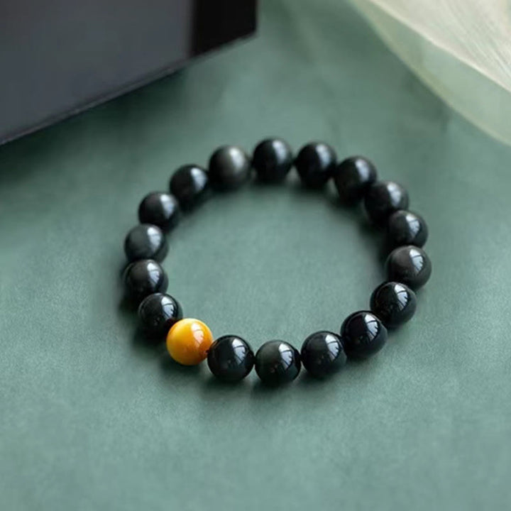 Schwarzes Obsidian Armband mit gelbem Tigerauge Stein elegant