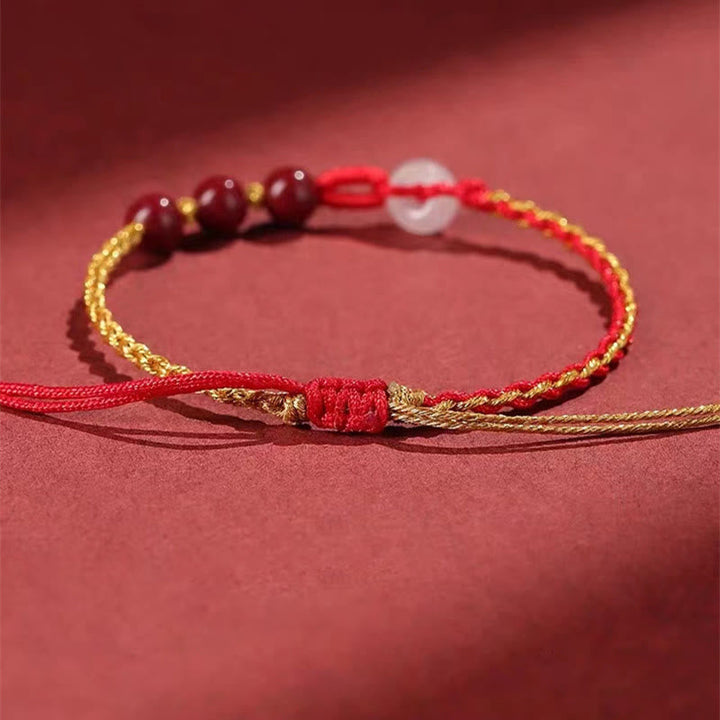 Armband Zinnober Jade Frieden Segen rotes Gold Perlen elastisch getragen