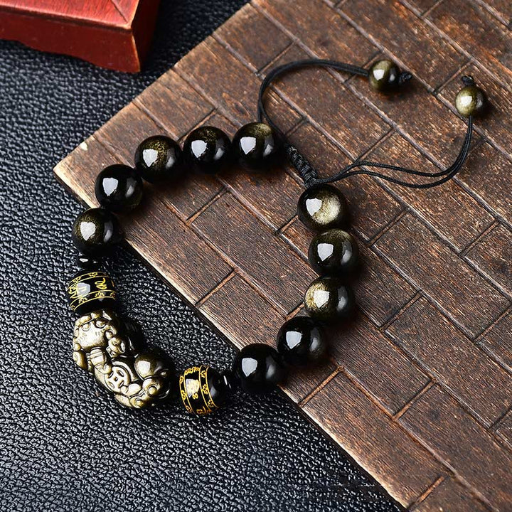 Schwarzes Obsidian Armband mit Om Mani Padme Hum Anhänger elegant.