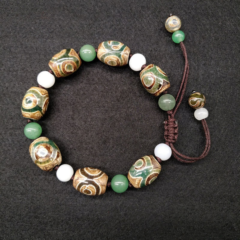 Armband Dzi Perle – Schutz & Glück grüne weiße Perlen braun Kordel