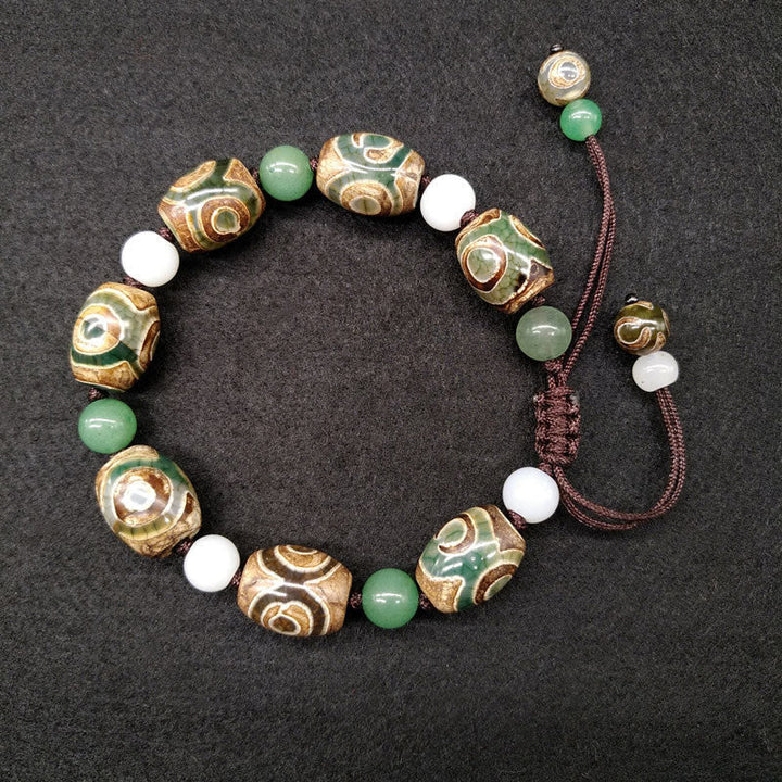 Armband Dzi Perle – Schutz & Glück grüne weiße Perlen braun Kordel