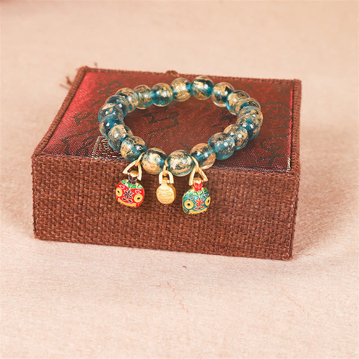 Armband Tibet Goldverschlingendes Wesen Family Stärke elastisch Perlen Charms.