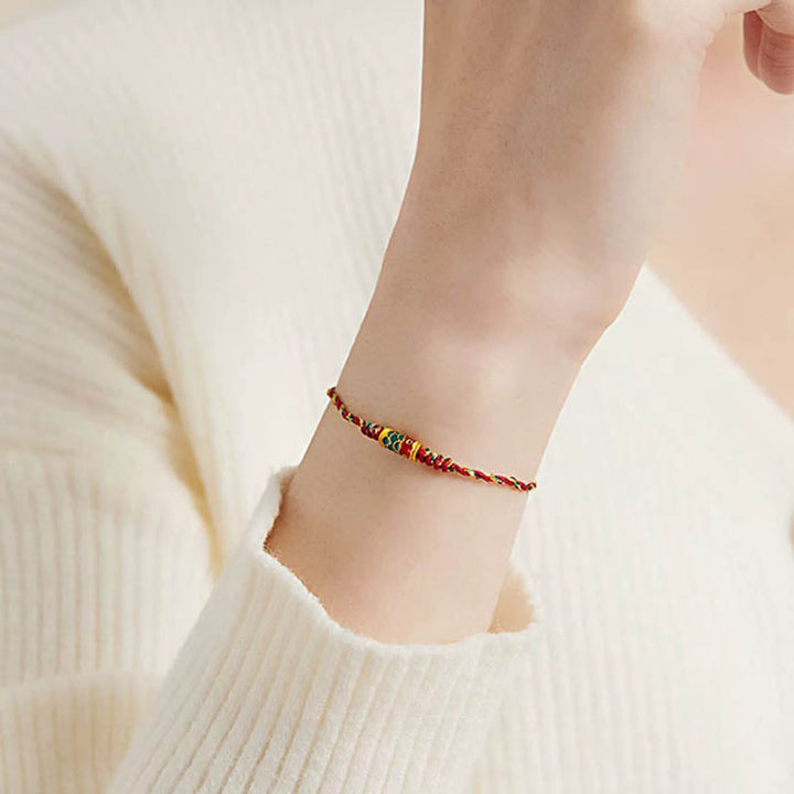 Armband Koi Fisch Wohlstand Energie rot gold geflochten Handgelenk
