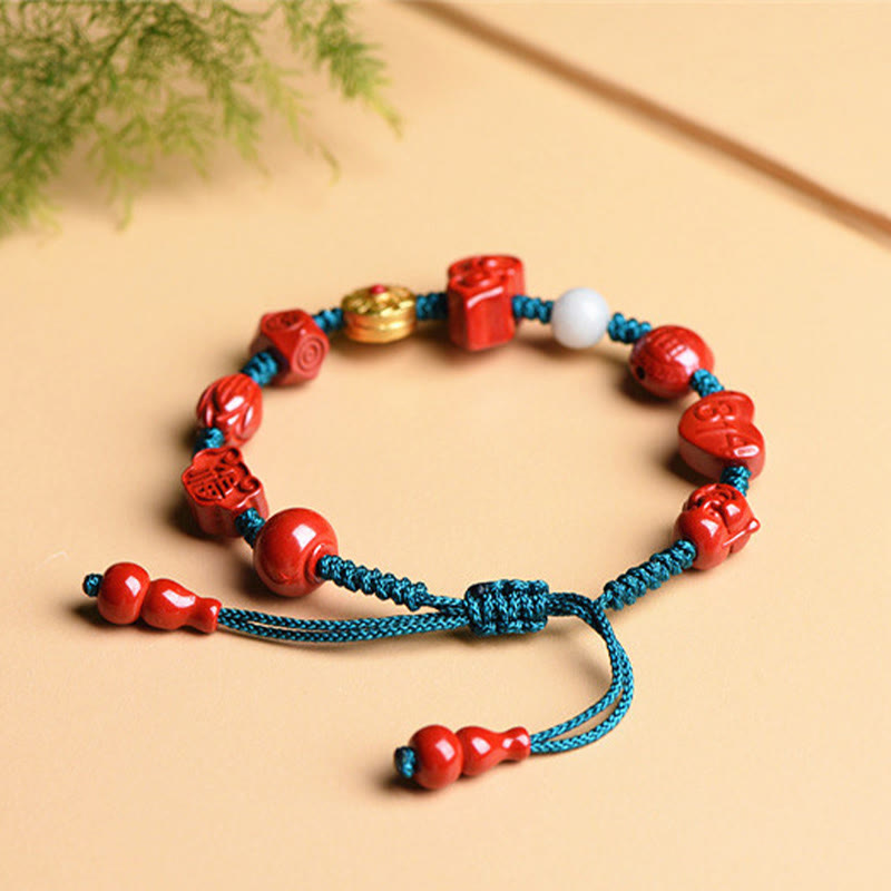 Rotes Zinnober Armband Zinnober Om Mani Padme Hum elastisch türkis Kordel