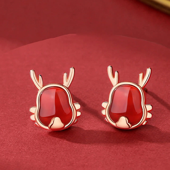 Rote Achat Rentier Ohrringe Roségold elegante Weihnachtsdeko glänzend.