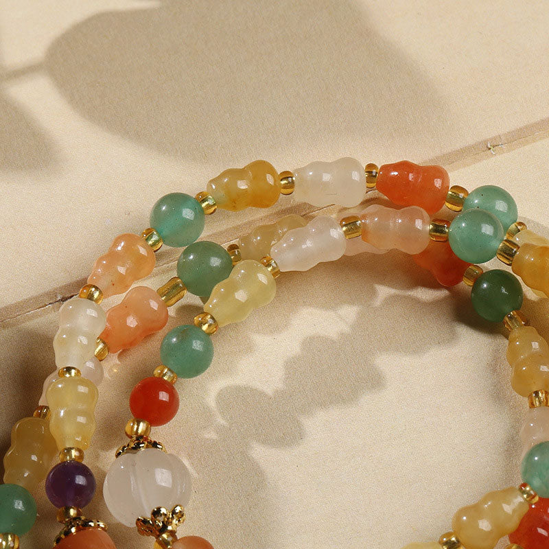 Jade Armband Wohlstand mehrfarbig Naturstein Perlen Gold elastisch Handgelenk.
