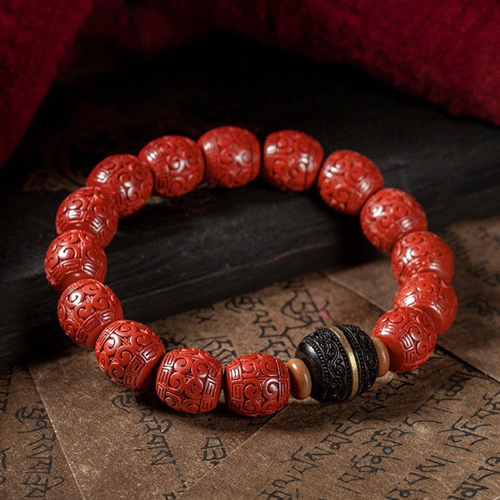 Rotes Zinnober Armband mit Ebenholz Perlen elastisch getragen elegant