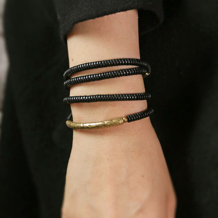 Armband Kupfer Ebenholz Balance schwarze elastische Perlen Handgelenk getragen