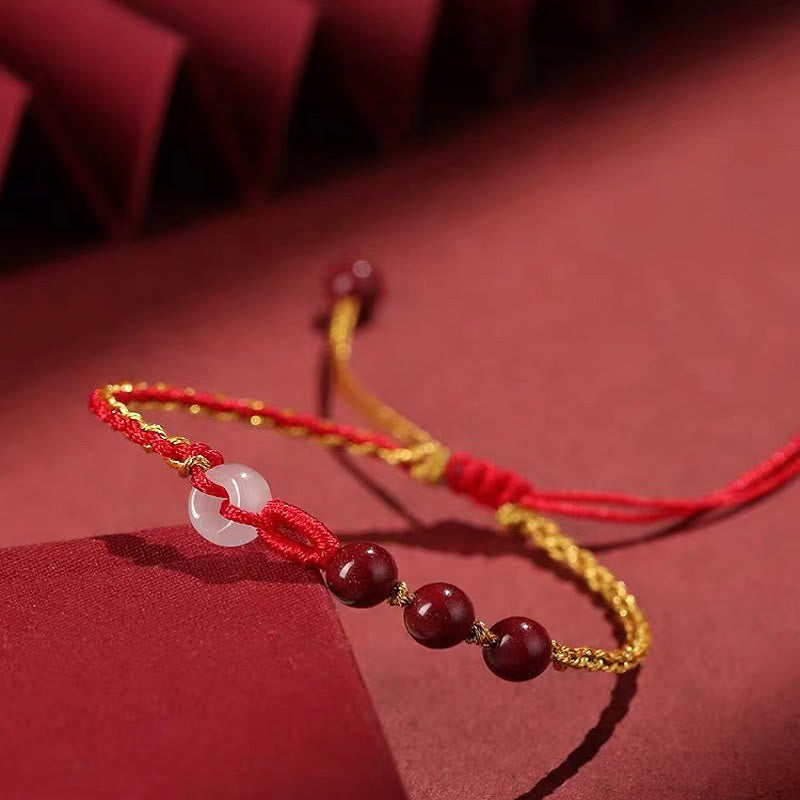 Armband Zinnober Jade mit roten Perlen und weißem Stein elegant.