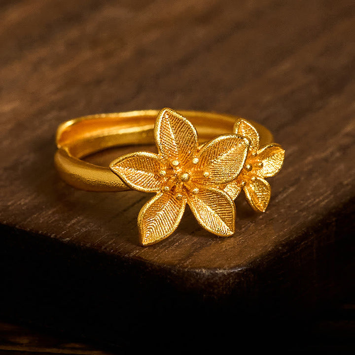 Vergoldeter Fingerring Kupfermessing Lila Blüte elegantes Blüten Design Schmuck
