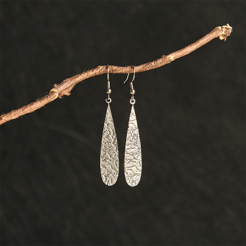 Ohrringe Titanstahl Hammerschlag Tropfenform Silber Boho Schmuck spirituell Ohrhänger