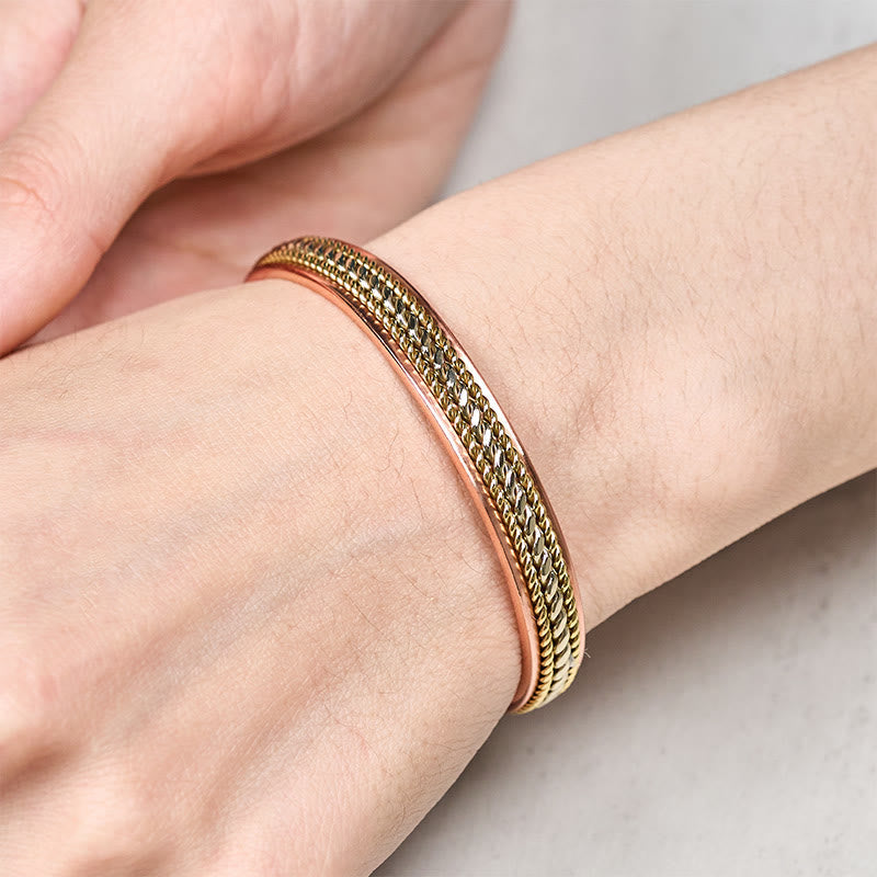 Armband Kupfer getragen Handgelenk Glück Balance Stärke geflochten Schmuck