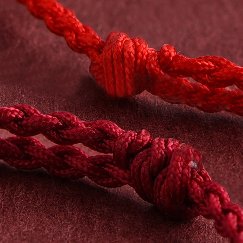 Armband Pfirsichholz Glück Wohlstand rote Schnur Knoten Detail Handarbeit