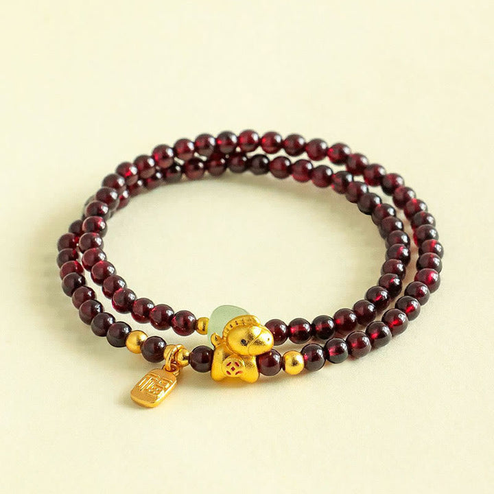 Armband Granat Jade Fu-Zeichen Stabilität goldener Elefant Anhänger Handgelenk